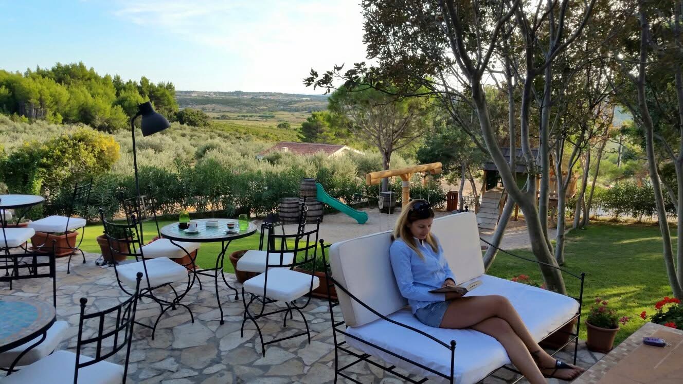 Viktoriia reading outdoors while living and working internationally